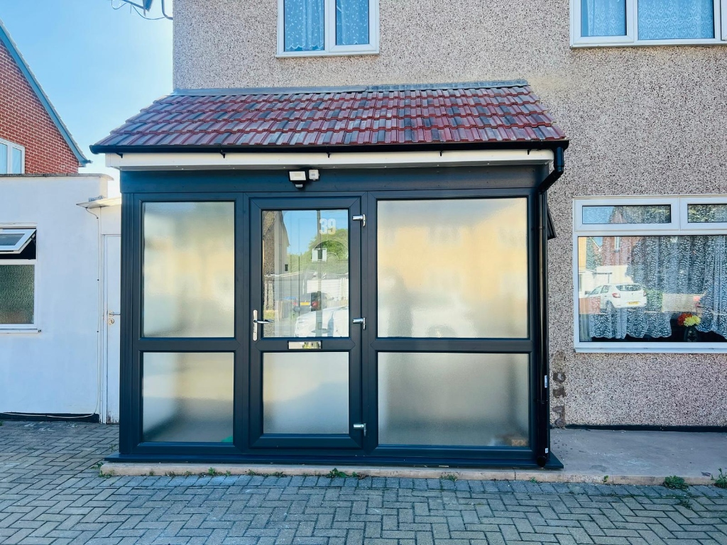 Anthracite aluminium glazed porch with frosted panels