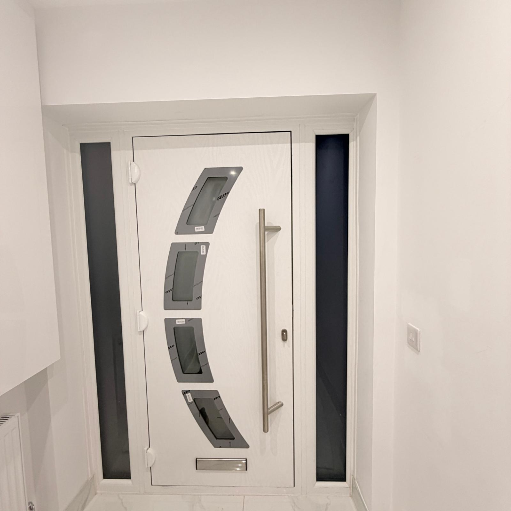 White modern aluminium door with geometric glazing panels